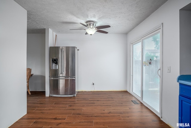 1656 Hitching Post Ln, Davenport, IA 52806 - kitchen with stainless steel refrigerator with ice dispenser, dark wood-type flooring, plenty of natural light, a ceiling fan, and a textured ceiling