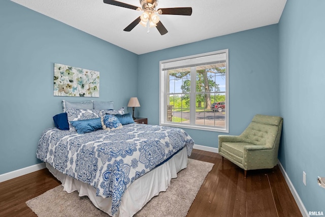 1335 N Utah Ave, Davenport, IA 52804 - bedroom featuring wood finished floors, baseboards, and a ceiling fan