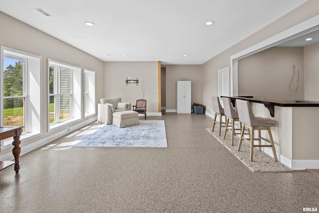 1335 N Utah Ave, Davenport, IA 52804 - sitting room with baseboards, recessed lighting, and speckled floor