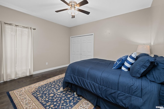 1335 N Utah Ave, Davenport, IA 52804 - bedroom with baseboards, finished concrete floors, a ceiling fan, and a closet