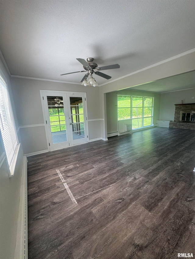 1510 Lazy Ln, Clinton, IA 52732 - unfurnished living room featuring healthy amount of natural light, ceiling fan, ornamental molding, wood finished floors, and a textured ceiling