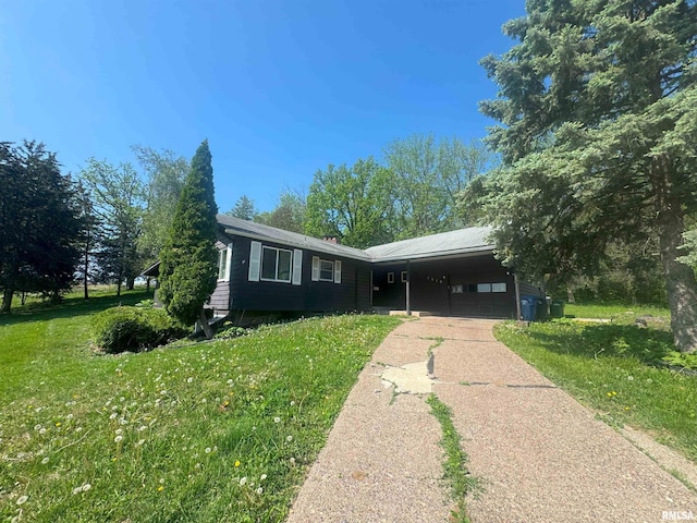 1510 Lazy Ln, Clinton, IA 52732 - ranch-style home with concrete driveway, a front lawn, and a garage