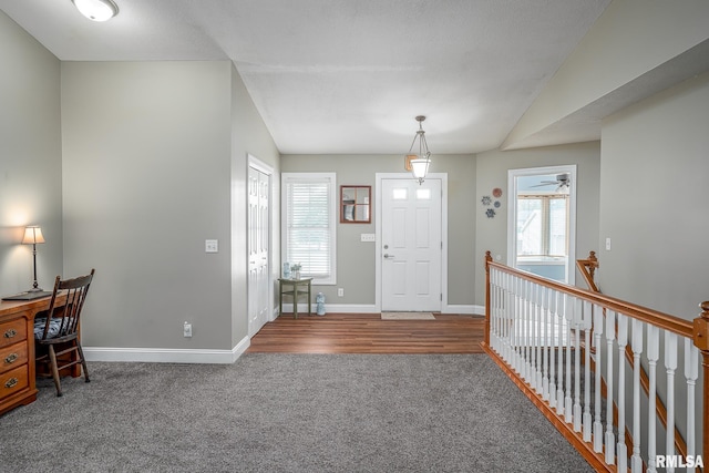 6939 Cresthill Dr, Davenport, IA 52806 - carpeted foyer featuring baseboards and a ceiling fan