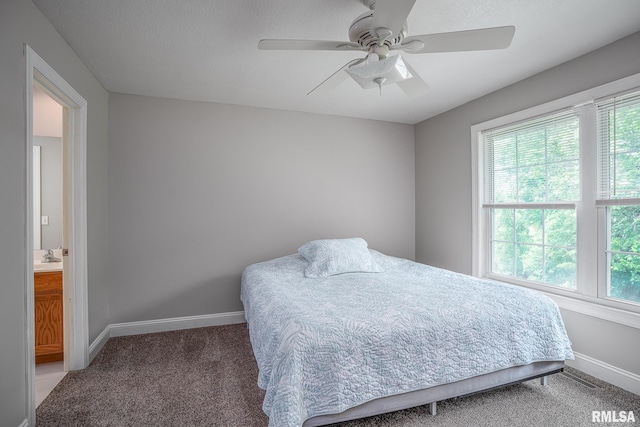 6939 Cresthill Dr, Davenport, IA 52806 - bedroom featuring multiple windows, baseboards, and light colored carpet