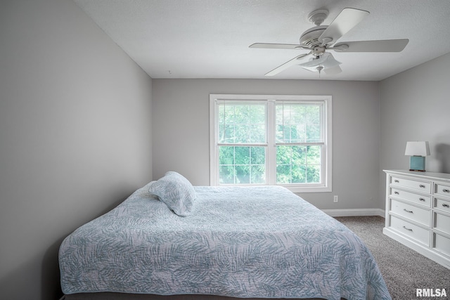 6939 Cresthill Dr, Davenport, IA 52806 - carpeted bedroom featuring baseboards and a ceiling fan