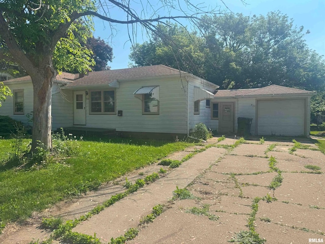 1515 Lazy Ln, Clinton, IA 52732 - view of front of house with concrete driveway, an attached garage, and a front yard