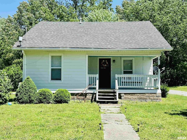 211 Chestnut St, Cambria, IL 62915 - view of front of house featuring covered porch, a shingled roof, and a front yard