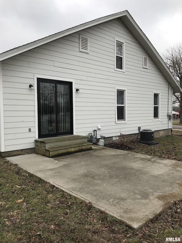 211 Chestnut St, Cambria, IL 62915 - back of house featuring cooling unit, a patio, and entry steps