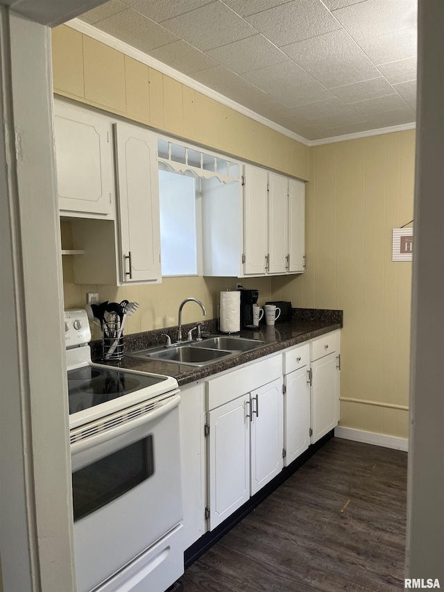 610 E Illinois Ave, Carterville, IL 62918 - kitchen featuring white electric range oven, a sink, ornamental molding, white cabinets, and dark countertops
