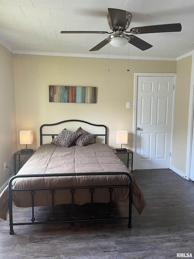 610 E Illinois Ave, Carterville, IL 62918 - bedroom featuring crown molding, wood finished floors, baseboards, and a ceiling fan