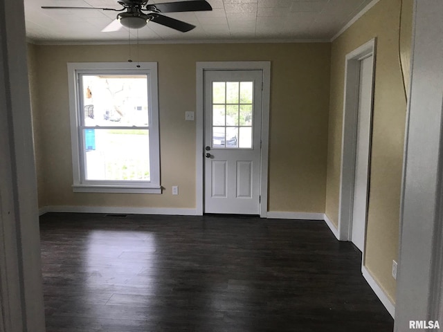 610 E Illinois Ave, Carterville, IL 62918 - entryway with crown molding, dark wood finished floors, ceiling fan, and baseboards