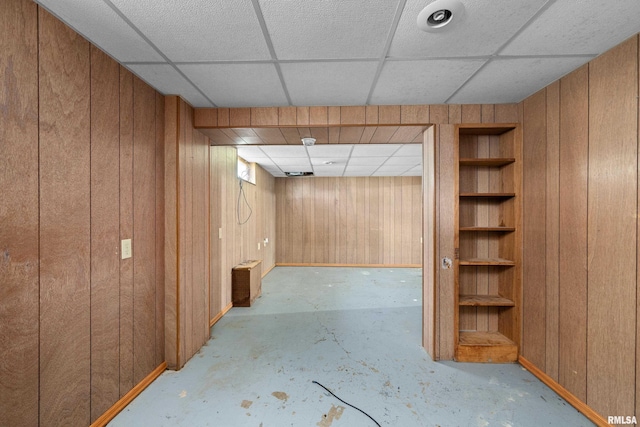 1206 10th Ave N, Clinton, IA 52732 - finished basement with a drop ceiling, wooden walls, built in features, and baseboards