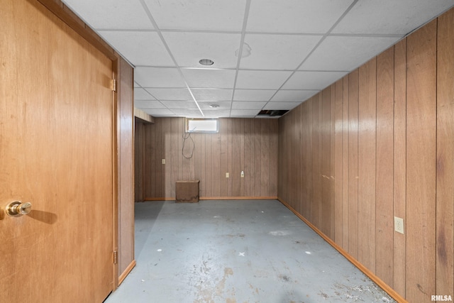 1206 10th Ave N, Clinton, IA 52732 - below grade area featuring a paneled ceiling and wood walls