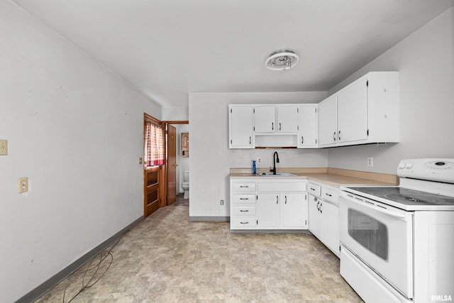 1206 10th Ave N, Clinton, IA 52732 - kitchen featuring white electric range oven, a sink, white cabinets, light countertops, and open shelves