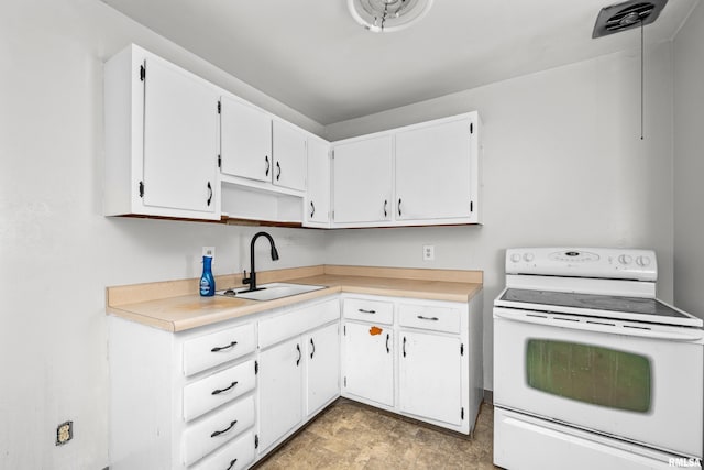 1206 10th Ave N, Clinton, IA 52732 - kitchen featuring white electric range oven, a sink, white cabinetry, light countertops, and open shelves