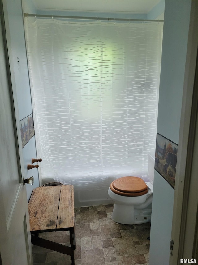 2322 4th St Unit A, East Moline, IL 61244 - full bathroom with stone finish flooring, shower / bath combination, and toilet