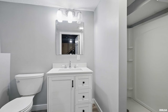 1413 N Pioneer St, Davenport, IA 52804 - bathroom with vanity, toilet, a shower, and baseboards