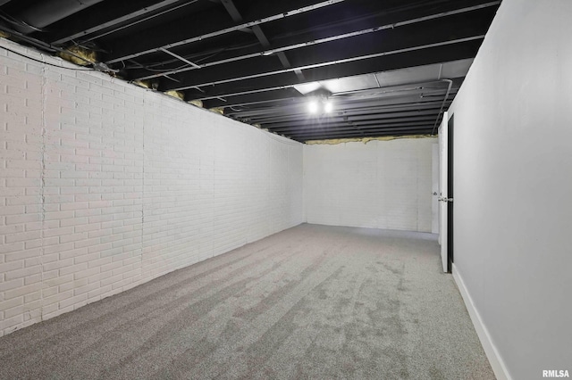 1413 N Pioneer St, Davenport, IA 52804 - finished below grade area featuring brick wall and carpet floors