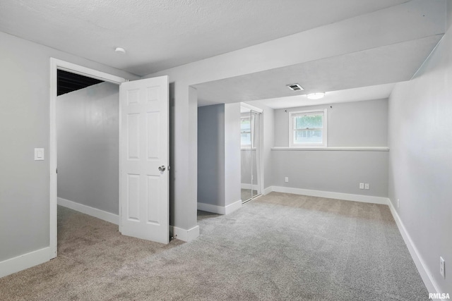 1413 N Pioneer St, Davenport, IA 52804 - below grade area featuring carpet floors and baseboards