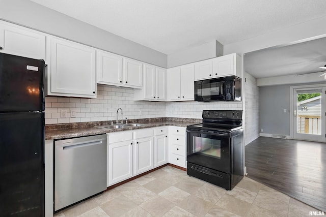 1413 N Pioneer St, Davenport, IA 52804 - kitchen featuring black appliances, a sink, backsplash, and dark countertops