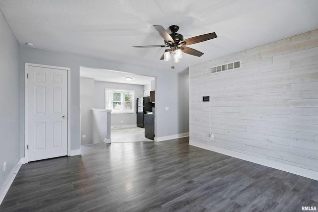 1413 N Pioneer St, Davenport, IA 52804 - unfurnished room featuring ceiling fan, dark wood finished floors, and baseboards