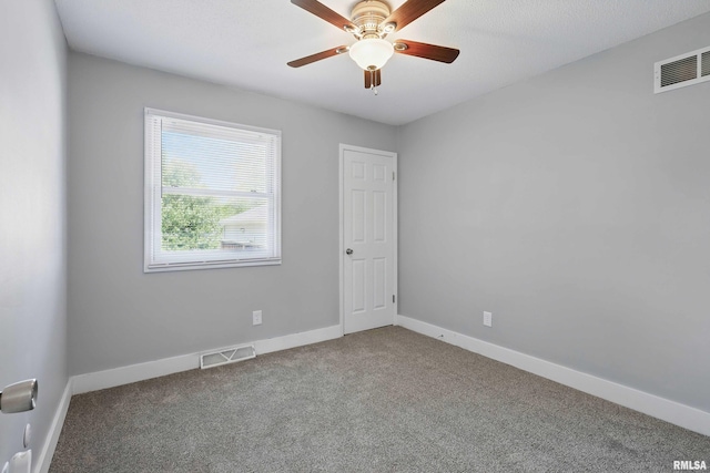 1413 N Pioneer St, Davenport, IA 52804 - carpeted spare room with baseboards and ceiling fan