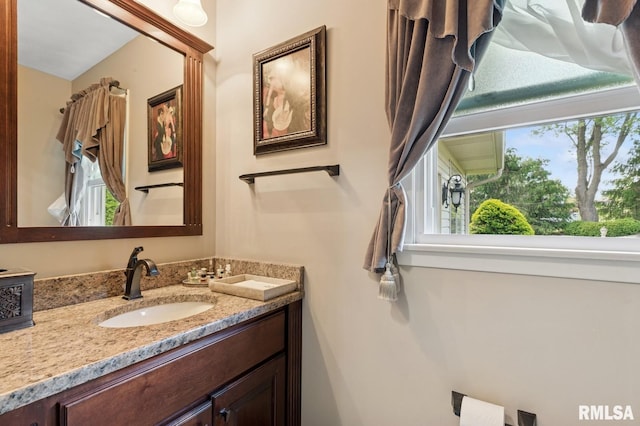 741 12th Ave N, Clinton, IA 52732 - bathroom with vanity and plenty of natural light