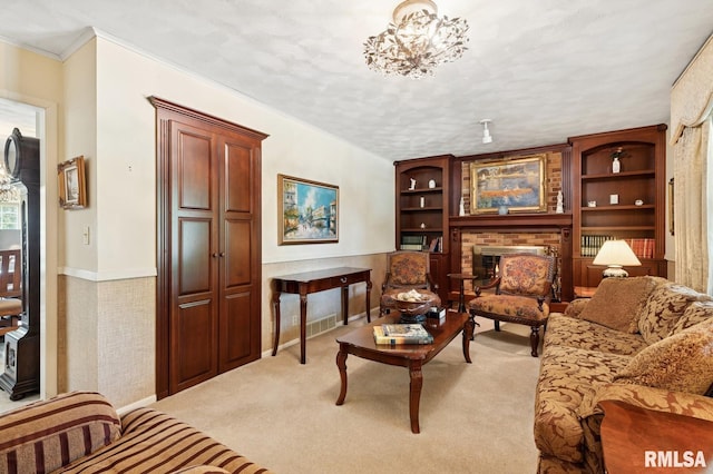 741 12th Ave N, Clinton, IA 52732 - living room with light colored carpet, ornamental molding, baseboards, a brick fireplace, and built in shelves
