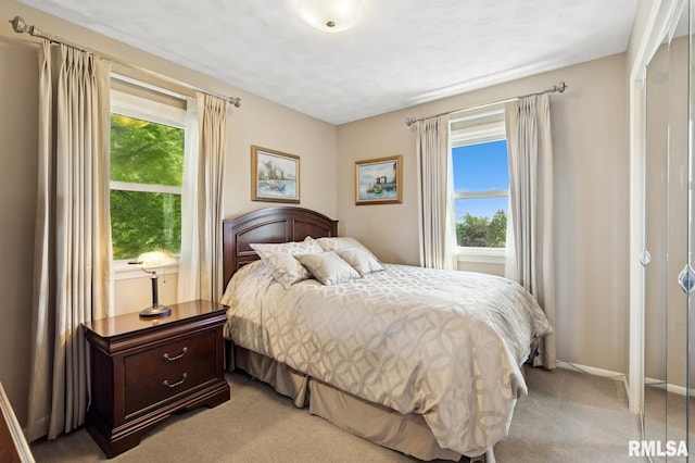 741 12th Ave N, Clinton, IA 52732 - bedroom with light colored carpet and baseboards