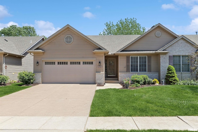 1361 Pinnacle Pines Ct, Bettendorf, IA 52722 - view of front of property with an attached garage, concrete driveway, brick siding, a front yard, and a shingled roof