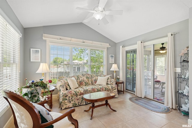 1361 Pinnacle Pines Ct, Bettendorf, IA 52722 - living area featuring a ceiling fan, healthy amount of natural light, vaulted ceiling, and light tile patterned floors