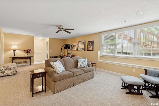 1361 Pinnacle Pines Ct, Bettendorf, IA 52722 - living area with carpet flooring, ceiling fan, and baseboards