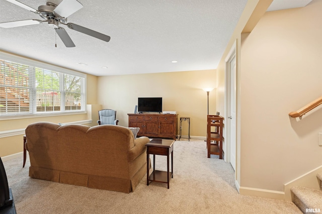 1361 Pinnacle Pines Ct, Bettendorf, IA 52722 - living area featuring light colored carpet, stairs, a ceiling fan, and baseboards