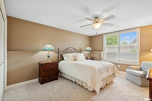 1361 Pinnacle Pines Ct, Bettendorf, IA 52722 - bedroom featuring light carpet, baseboards, and ceiling fan