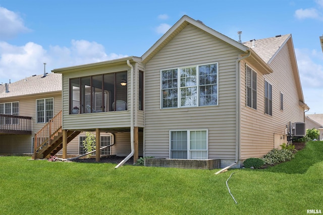 1361 Pinnacle Pines Ct, Bettendorf, IA 52722 - back of property featuring a lawn, stairs, central AC unit, and a sunroom