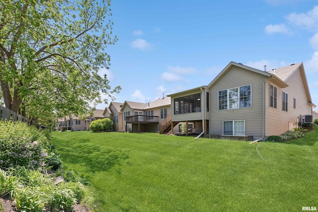 1361 Pinnacle Pines Ct, Bettendorf, IA 52722 - back of house with cooling unit, stairs, a sunroom, a yard, and a deck