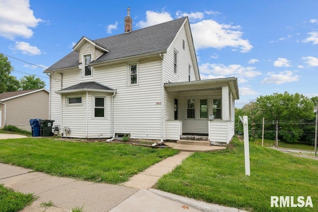 1603 Judson St, Davenport, IA 52803 - view of front of home featuring a front lawn and a chimney