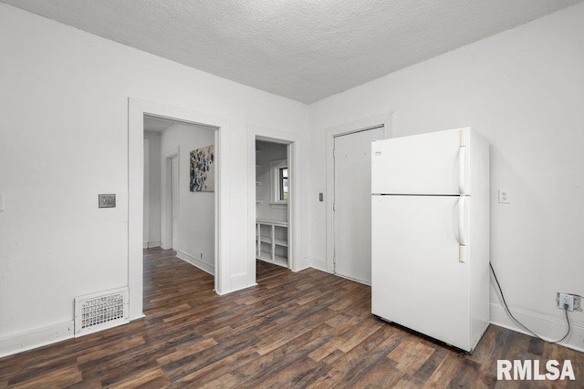 1603 Judson St, Davenport, IA 52803 - kitchen with freestanding refrigerator, wood finished floors, a textured ceiling, and baseboards
