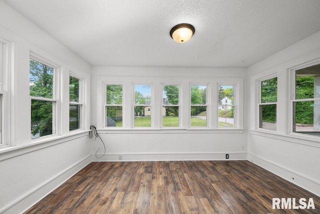 1603 Judson St, Davenport, IA 52803 - unfurnished sunroom with plenty of natural light, a textured ceiling, wood finished floors, and baseboards