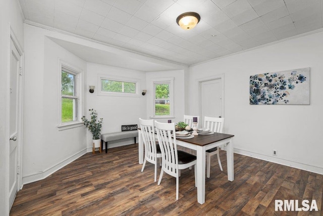 1603 Judson St, Davenport, IA 52803 - dining space featuring wood finished floors, crown molding, and baseboards