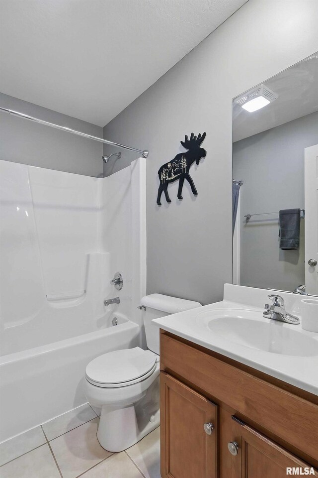 6732 Brookview Ln, Davenport, IA 52806 - full bathroom with vanity, tile patterned flooring, shower / tub combination, and toilet
