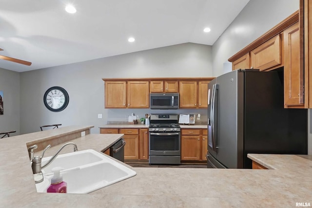 6732 Brookview Ln, Davenport, IA 52806 - kitchen featuring appliances with stainless steel finishes, a sink, light countertops, ceiling fan, and recessed lighting