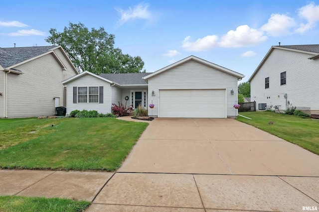 6732 Brookview Ln, Davenport, IA 52806 - view of front of property featuring an attached garage, a front lawn, concrete driveway, and central air condition unit