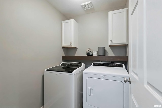 6732 Brookview Ln, Davenport, IA 52806 - laundry area with cabinet space and washing machine and dryer
