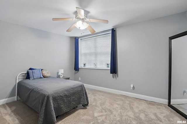 6732 Brookview Ln, Davenport, IA 52806 - carpeted bedroom featuring baseboards and a ceiling fan