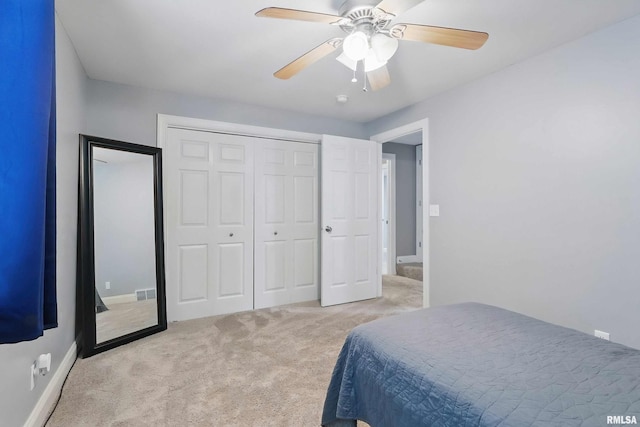 6732 Brookview Ln, Davenport, IA 52806 - bedroom with carpet floors, a closet, ceiling fan, and baseboards