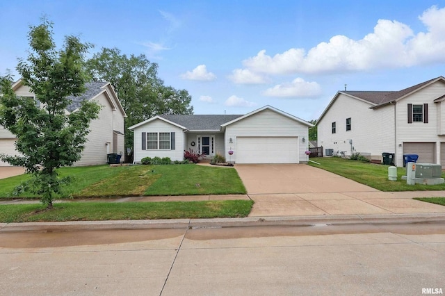 6732 Brookview Ln, Davenport, IA 52806 - view of front facade featuring a garage, driveway, and a front yard
