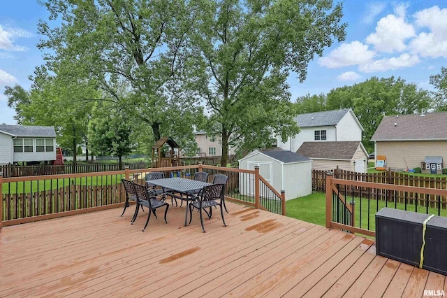 6732 Brookview Ln, Davenport, IA 52806 - wooden terrace with outdoor dining area and a residential view