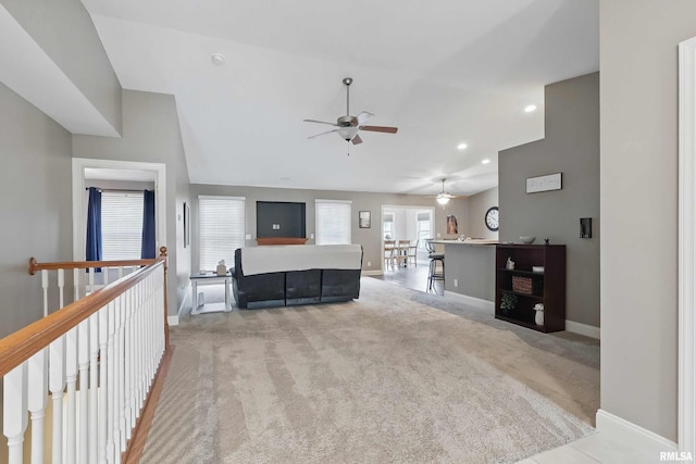 6732 Brookview Ln, Davenport, IA 52806 - carpeted living room with ceiling fan, baseboards, vaulted ceiling, and recessed lighting