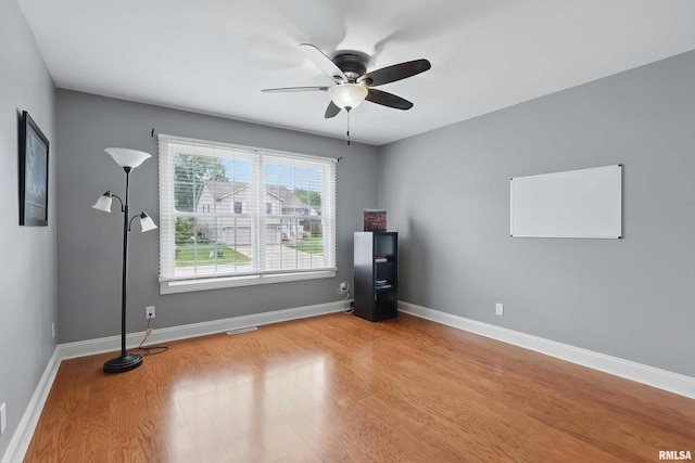 6732 Brookview Ln, Davenport, IA 52806 - empty room with a ceiling fan, light wood finished floors, and baseboards